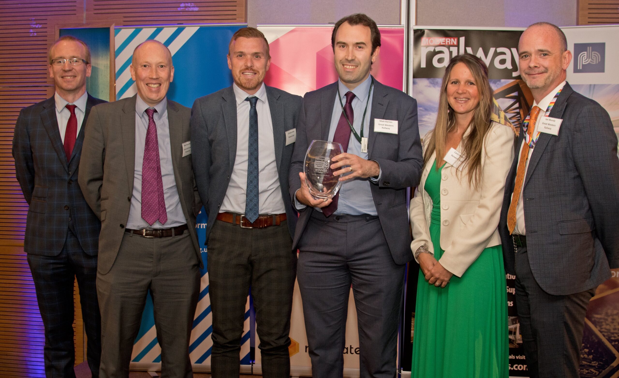 Philip Sherratt (left), editor of Modern Railways magazine, presented the award to Dartmoor Line partners.