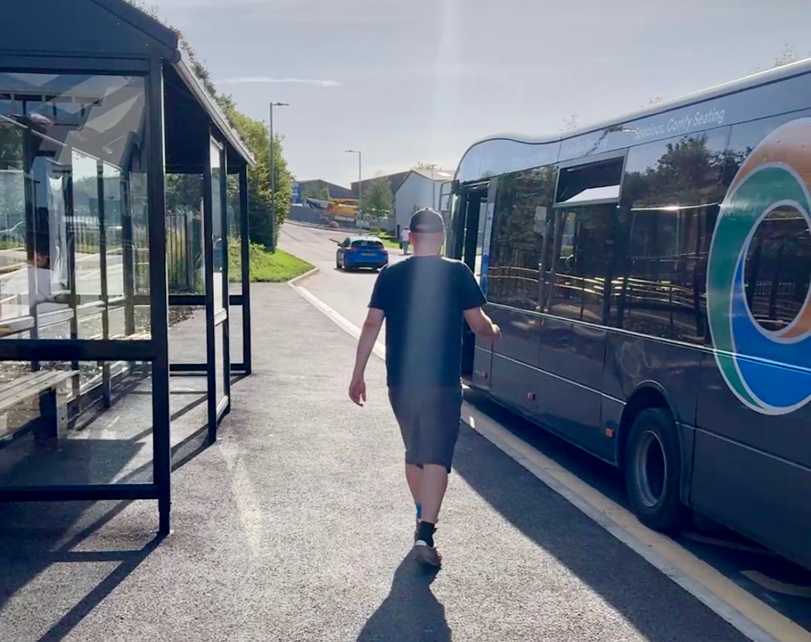 Person approaches 118 Stagecoach bus at bus stop