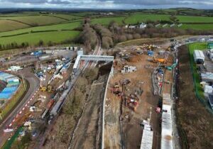 Site of new station, with footbridge, stairs and lift shaft installed, and work continuing on car park and platform
